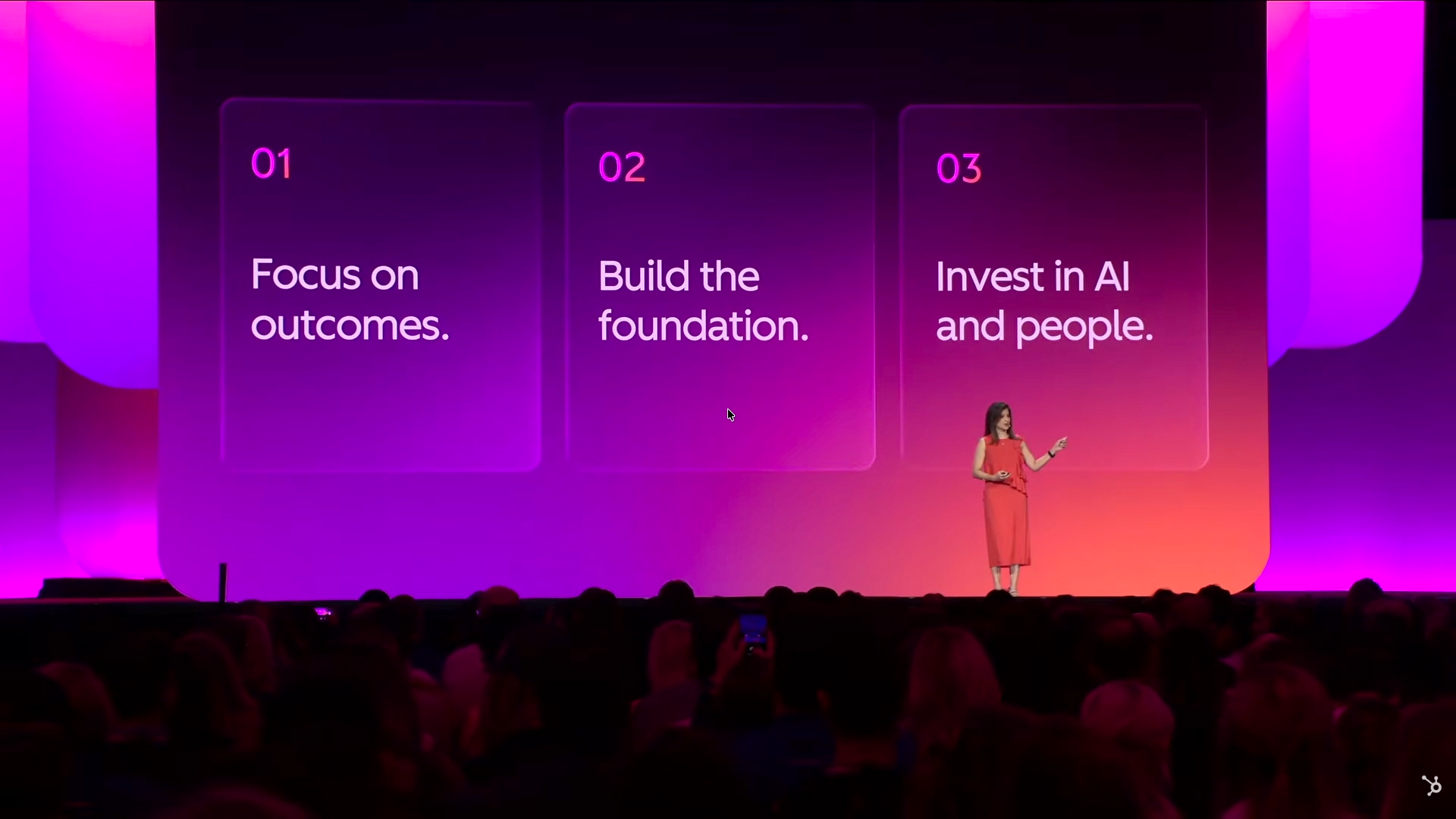 Stage slide with three numbered panels reading 01 Focus on outcomes and 02 Build the foundation
