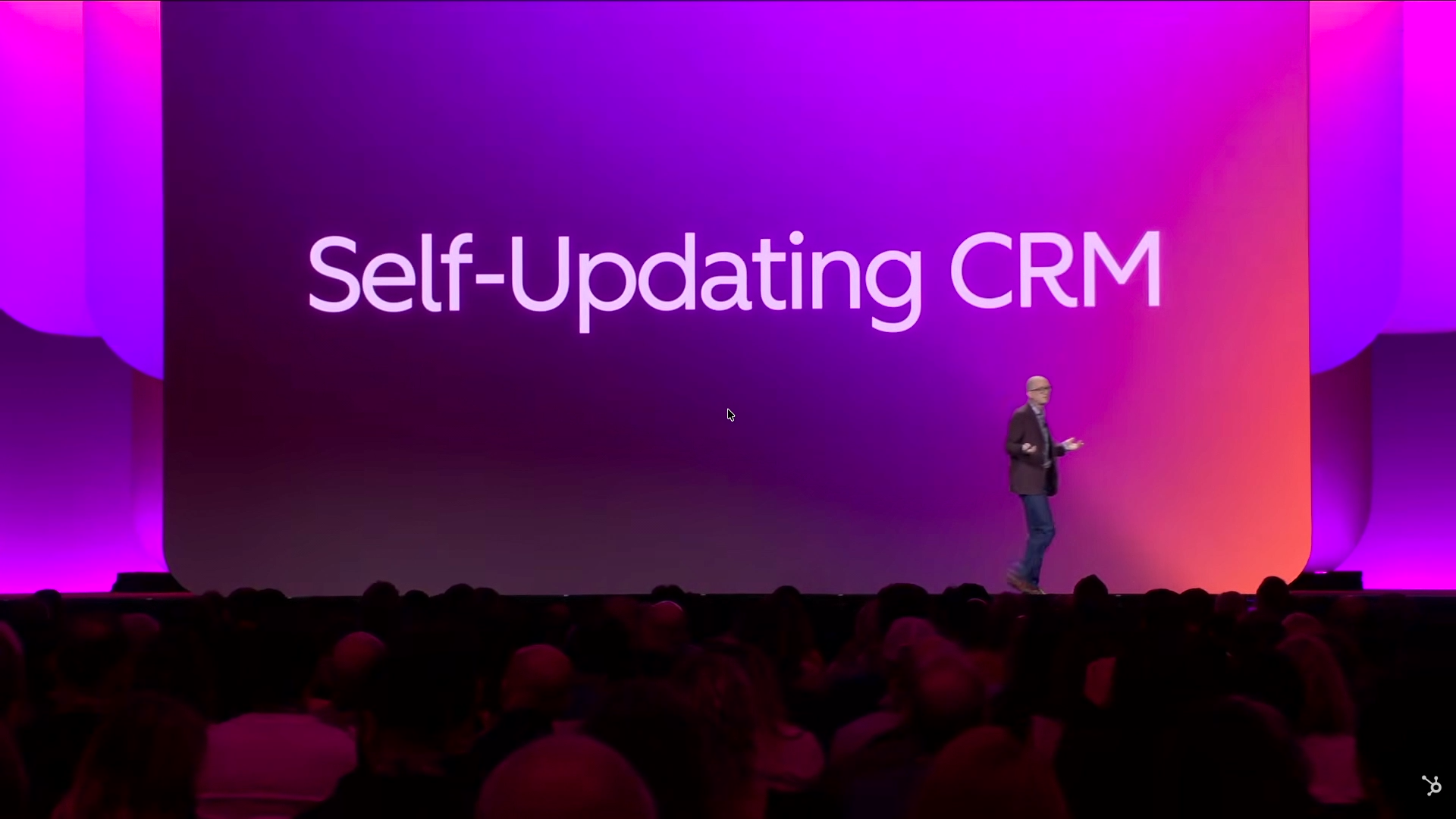 Stage screen displaying the words Self-Updating CRM in white on a gradient background