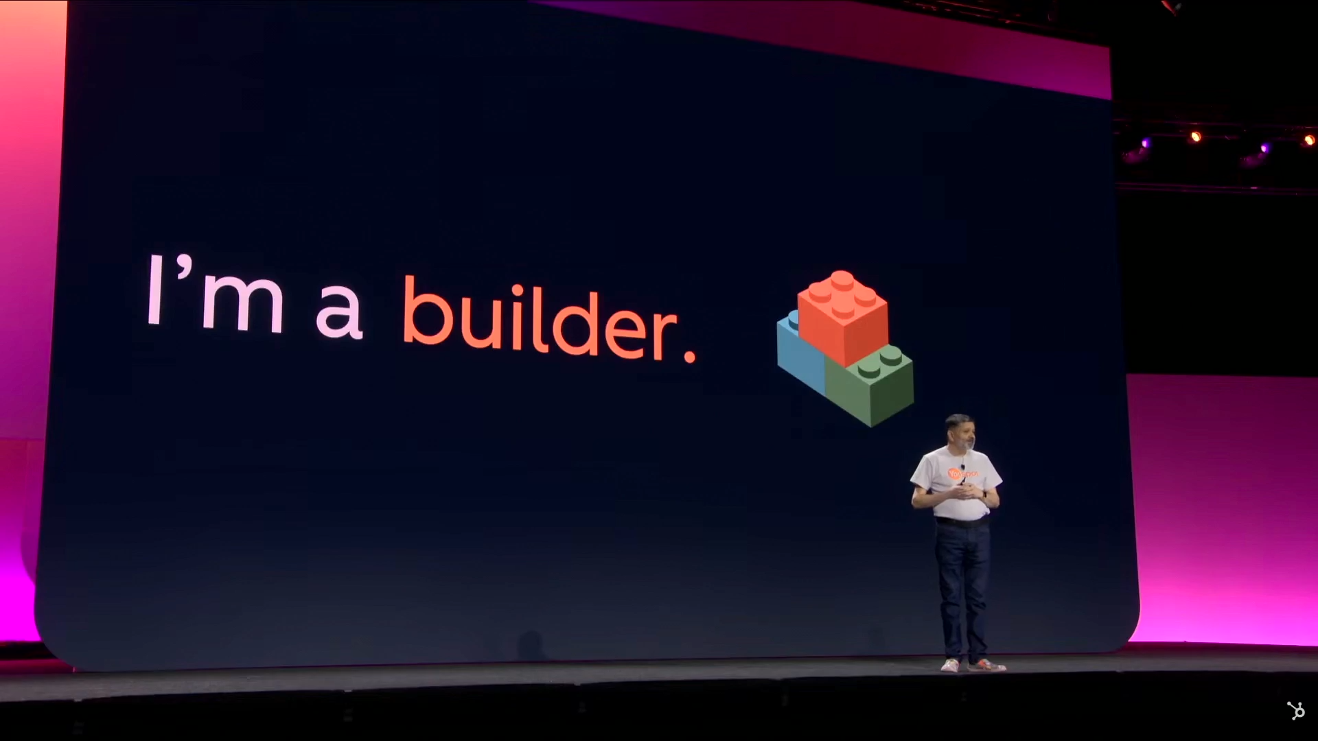 Stage screen showing the words ‘I’m a builder.’ in white and orange lettering beside a small graphic.