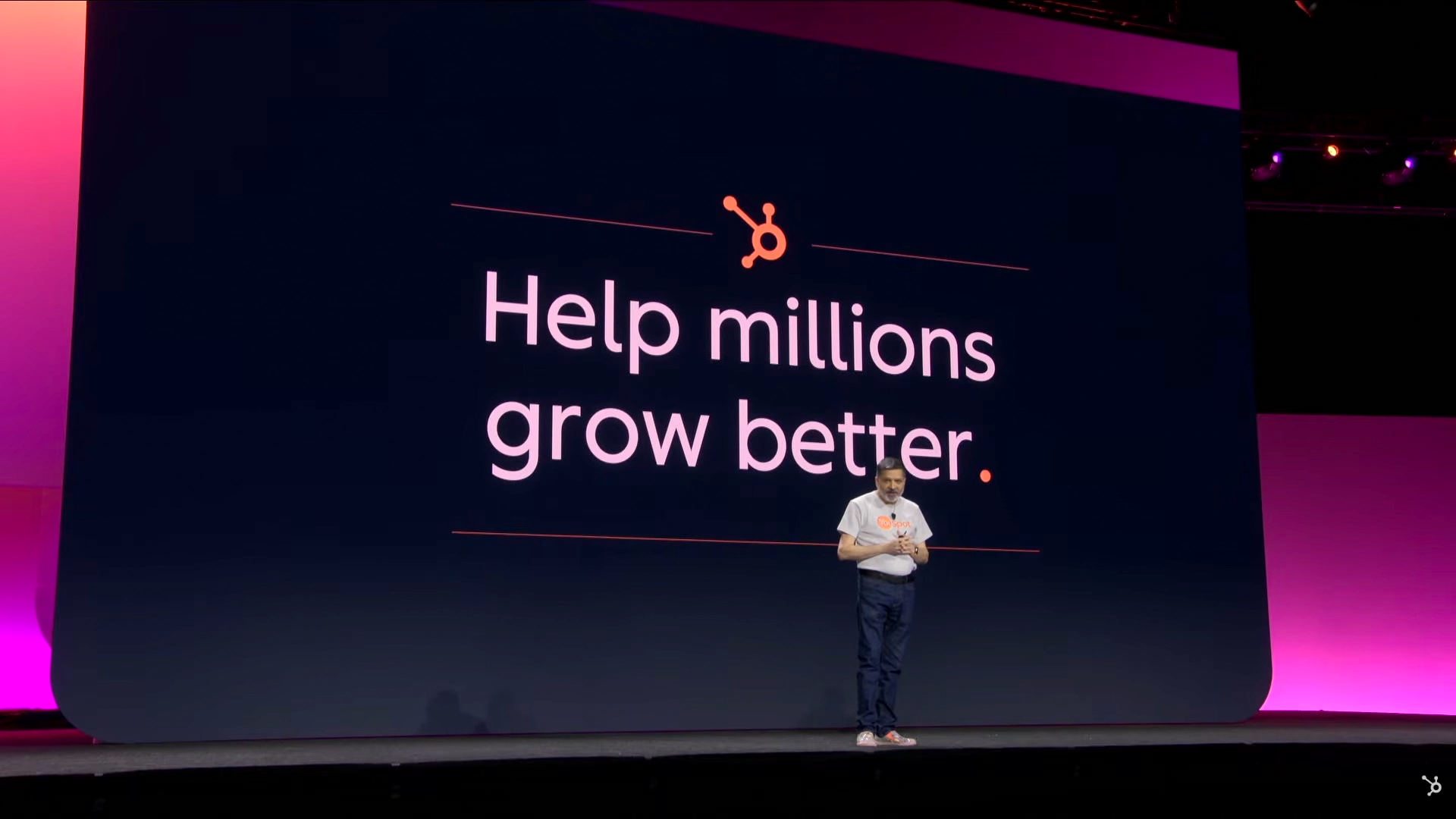 Stage screen showing the HubSpot logo with the words ‘Help millions grow better.’