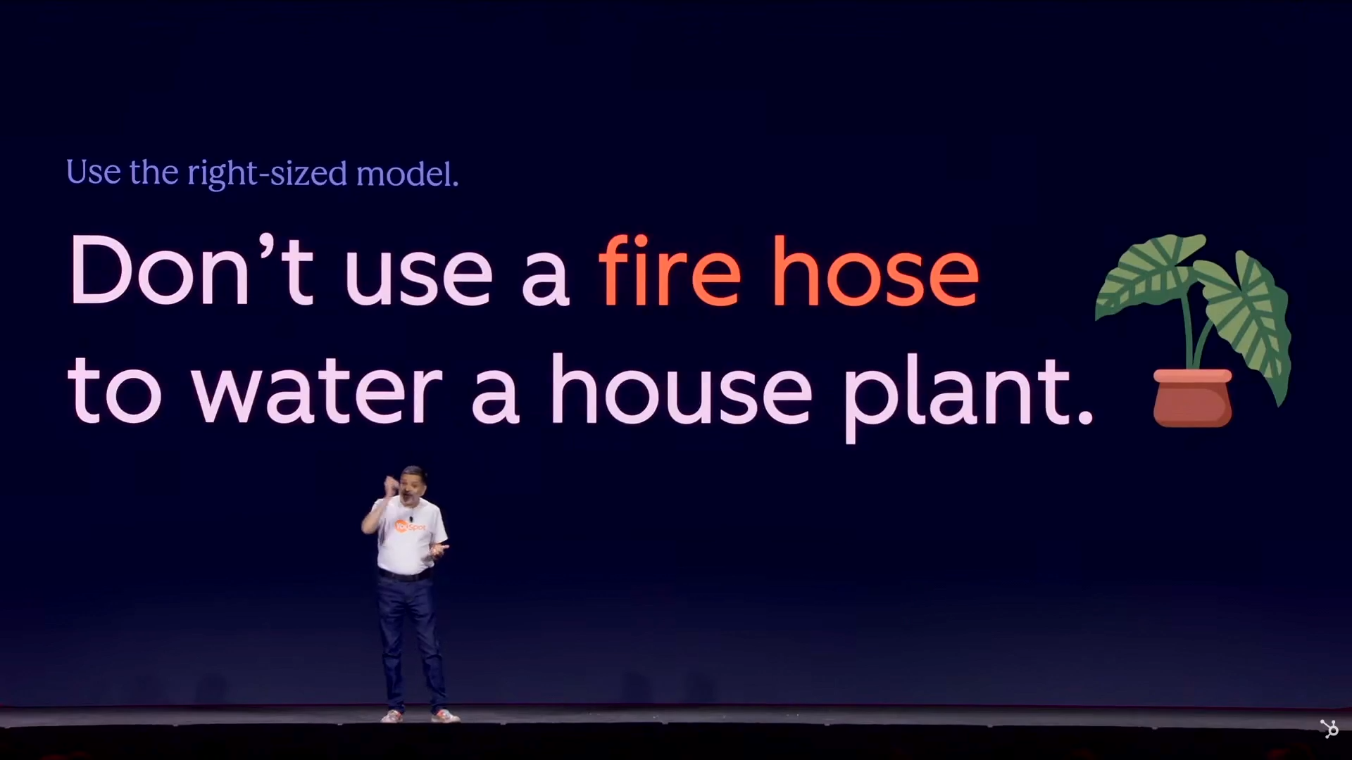 Slide reading ‘Don’t use a fire hose to water a house plant.’ on a dark background.